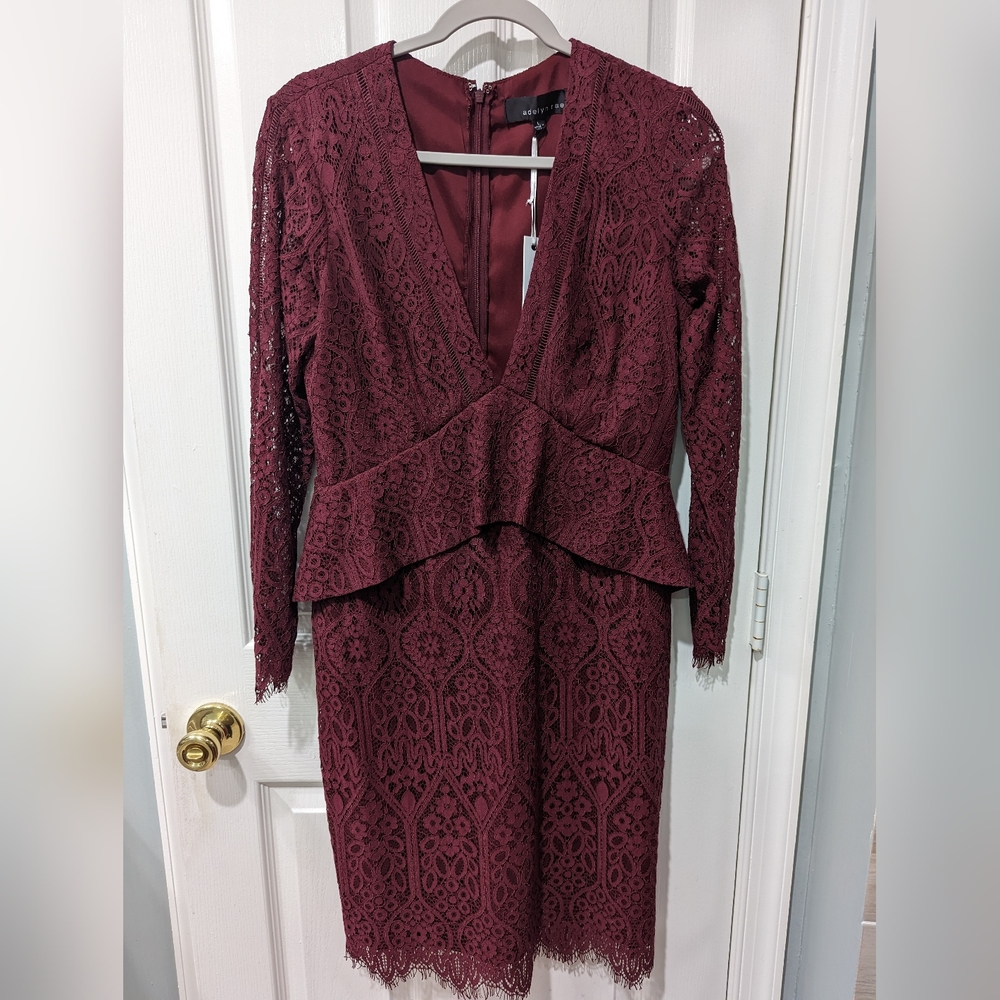 Red lace dress with peplum and deep neckline